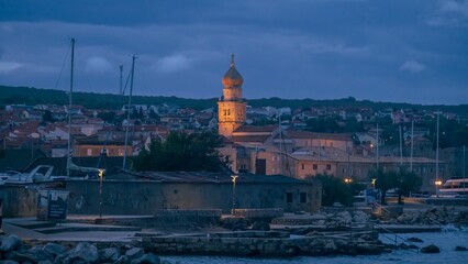 Fototapeta premium Scenic view of a small city on Krk island seen during the nighttime