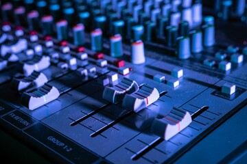 Close-up shot of an audio mixer in a studio