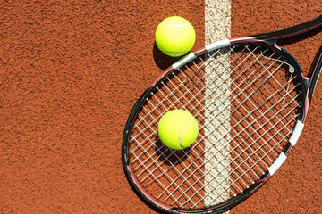 tennis racket with a tennis ball on a tennis court