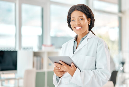 Black woman, tablet and portrait of a scientist in laboratory, hospital or science research for medicine, chemistry or innovation. Doctor, technology and medical worker with smile in clinic or lab