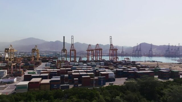Cargo Containers And Cranes At The Port of Manzanillo In Manzanillo, Colima, Mexico. Aerial Drone Shot