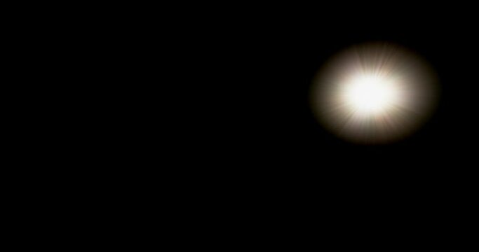 Motion lens sun flare on black background
