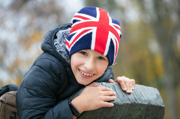 Happy child in a hat with the British flag.