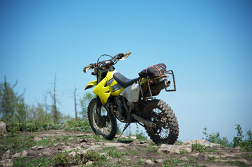 motorcycle on the road, enduro motorcycle against the blue sky