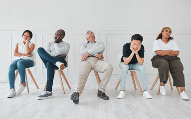 Bored, job interview and diversity with business people in waiting room for tired, frustrated or fatigue. Hiring, hr and queue with employees on wall background for recruitment, onboarding or nervous - obrazy, fototapety, plakaty