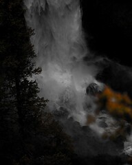 Fototapeta na wymiar Stunning waterfall flowing into a river