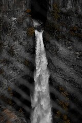 Stunning waterfall flowing into a river