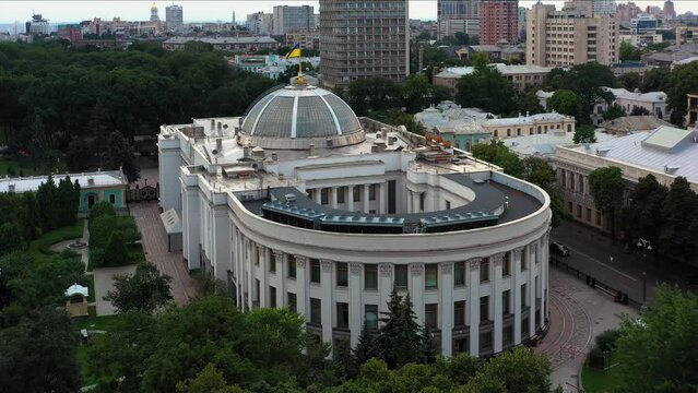 Verkhovna Rada parliament building with Kyiv cityscape. View from drone.