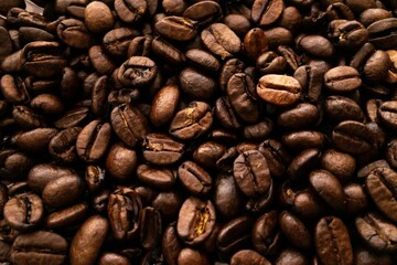 Closeup shot of a heap of roasted brown coffee beans