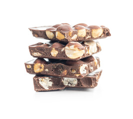 Broken chocolate bars with  nuts isolated on white background.