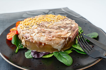 Homemade meat jelly with mustard and horseradish on the table. Beef and turkey meat jelly
