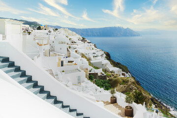 Obraz premium White architecture on Santorini island, Greece. Beautiful summer landscape. Blue sky and mountains.