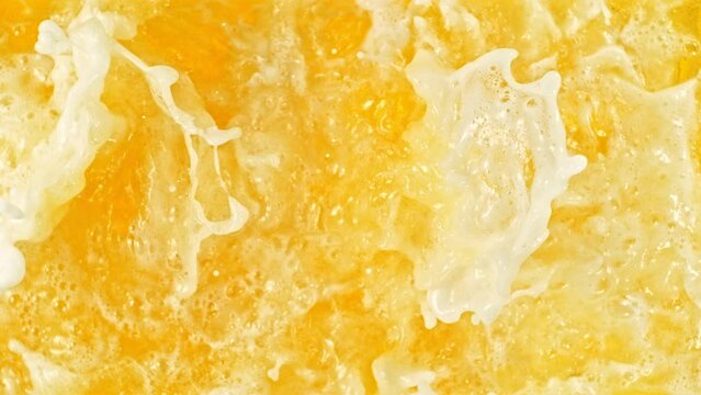 Super Slow Motion of Splashing Beer, Close-up. Filmed on High Speed Cinema Camera, 1000 fps. Top View Shot Composition. Speed Ramp Effect. - Powered by Adobe