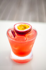 Vertical shot of a fresh cocktail on the white table