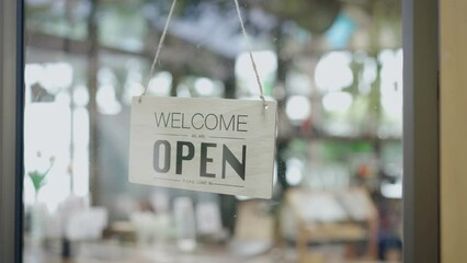 Woman barista waitress open sign on glass door modern coffee shop ready to serve restaurant cafe retail store, Small business owner food and beverage concept - Powered by Adobe