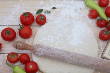 Dough, pizza,rolling pin, wooden background, tomatoes, pepper, recipe book, pizza home baking, cooking method, background, background image, wallpaper, for presentations, food,home baking 