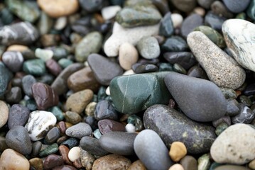 Fototapeta na wymiar Closeup of a heap of colorful pebbles.