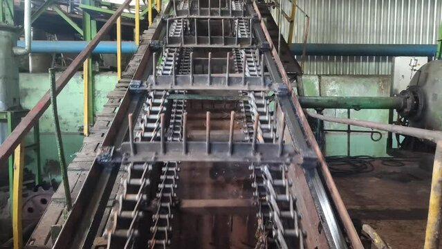 Video 4k of Conveyor chain can be interpreted as a walking chain, because it consists of a series of chains that are designed to move in a circular manner. Can move - rotate up and down or sideway.