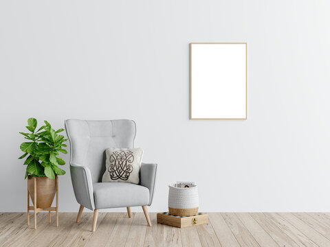 Free PSD a white wall with a picture frame mockup and a chair in the corner. Decorated home mockup with free space. 3d illustration, 3d rendering.