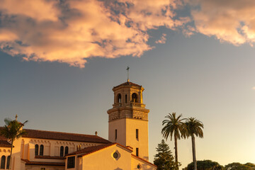 Fototapeta na wymiar 2021-03-24 A OLD SPANISH STYLED CHURCH WITH PALM TREES AND A NICE SKY IN LA JOLLA CALIFORNIA