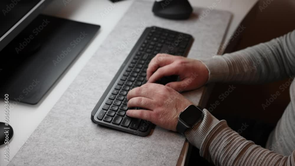 Poster closeup video of businessman typing text on the keyboard with both hands