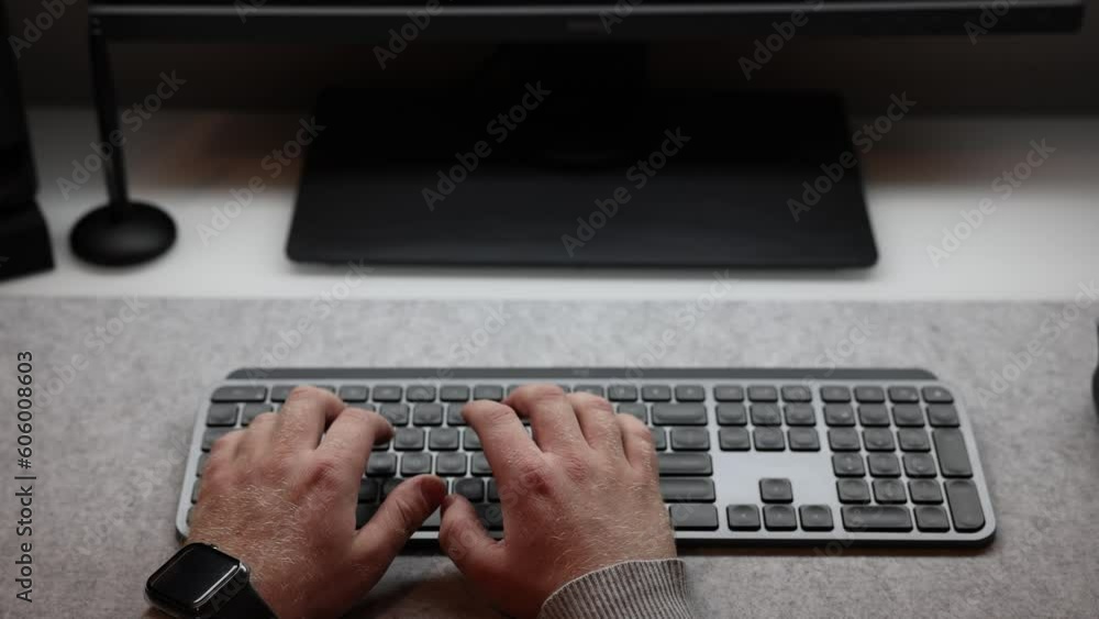 Poster closeup video of businessman typing text on the keyboard with both hands