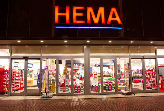 Nijmegen, Netherlands - December 3, 2019: Entrance of a HEMA store at night. HEMA a Dutch discount retail chain