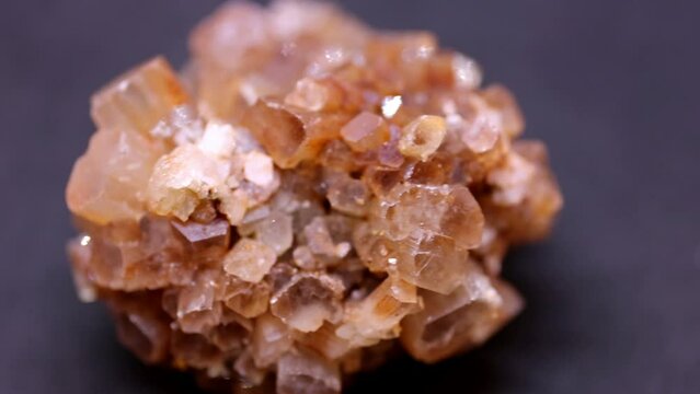 Macro shot of aragonite mineral from Marocco on purple background