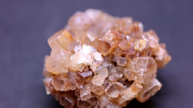 Macro shot of aragonite mineral from Marocco on purple background
