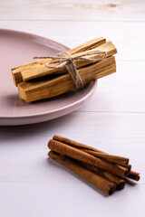 Natural incense for home scenting and meditation: palo santo sticks, cinnamon sticks and orange slices
