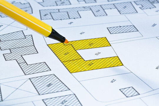 Imaginary cadastral map with buildings, land parcel and vacant plot - land and property registry and real estate property concept illustration