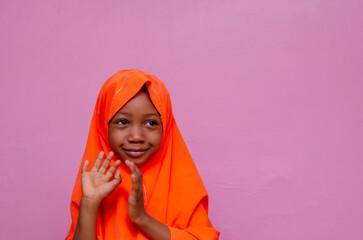 young beautiful excited Muslim girl, waving to the camera