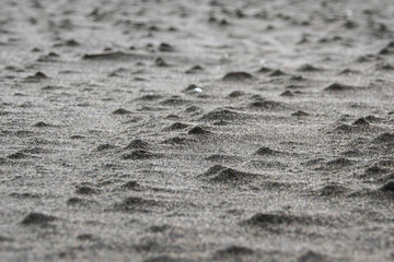 Close-up shot of lumpy sand on the beach - obrazy, fototapety, plakaty