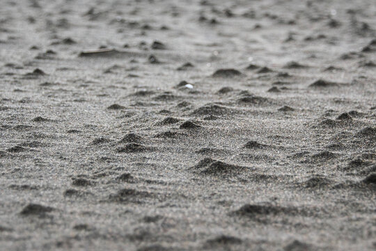 Close-up shot of lumpy sand on the beach