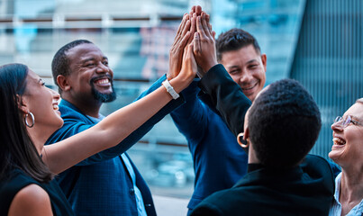 High five, collaboration and motivation with a business team on a balcony together for success or...