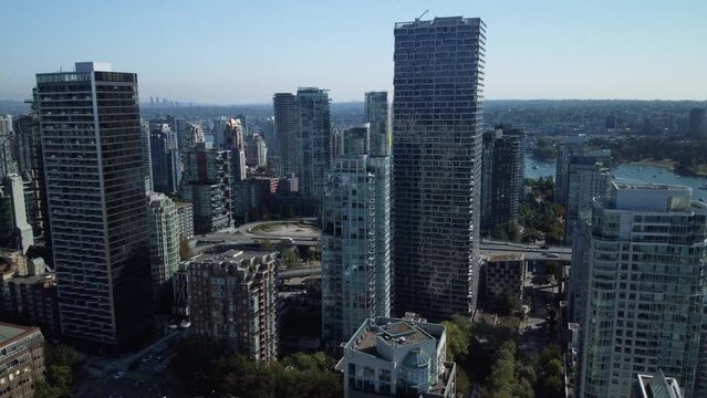 Aerial view of cars on a bridge on false creek with Vancouver City buildings