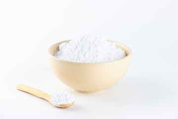 Tapioca starch in a bowl and wooden spoon.