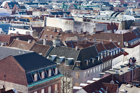 Aerial cityscape of the skyline with many brown roofs of the center of Copenhagen in Denmark