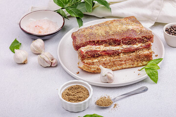 Piece of salty high-fat meat cooked with spices. Salo, bacon, lard, silverside, gammon