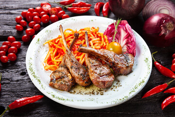 rack of lamb with pasta tomato sauce and salad
