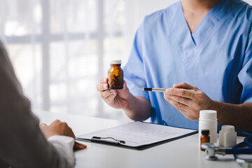 Doctor recommending medicine, how to take medicine, examination, treatment. Medical and health concept.