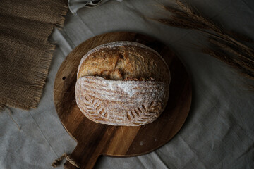 Artisan Batard Sourdough healthy Bread. Open crumb high hydration Sourdough french country bread set on dark background. - 606024037