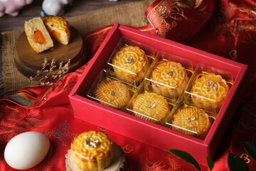 Box of Mooncake a Chinese traditional pastry for Mid-Autumn festival. set on rustic wooden table. - 606024062