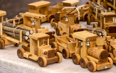 Handmade wooden cars on wheels at the fair.