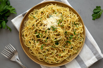 Homemade Italian Spaghetti Aglio e Olio on a Plate, top view. Flat lay, overhead, from above.