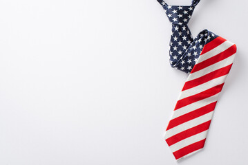 Celebratory items viewed from the top: necktie with USA flag pattern isolated on white background with space for text or advertising