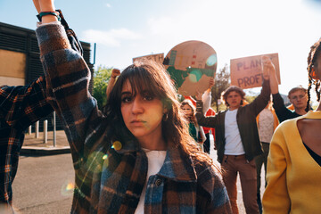 angry young woman protests in a march demonstration for global warming