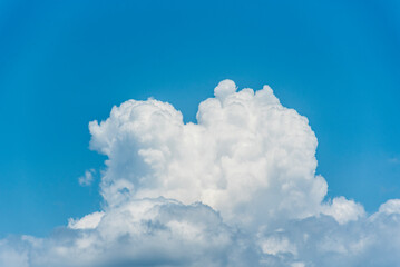 Naklejka na ściany i meble Big white clouds in a blue sky