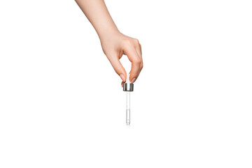 Female hand on a light background with a pipette.