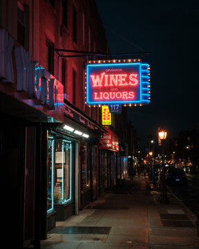 Granada Wines and Spirits vintage neon sign at night in Cobble Hill, Brooklyn, New York